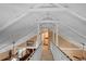 Spacious loft area with a walkway and window at 319 N Wales Dr, Lake Wales, FL 33853