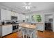 Modern kitchen with white cabinets, butcher block countertops, and island at 319 N Wales Dr, Lake Wales, FL 33853