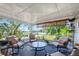 Bright sunroom with comfy seating and view of street at 319 N Wales Dr, Lake Wales, FL 33853
