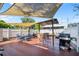 Spacious deck with seating, grill, and shade structure at 319 N Wales Dr, Lake Wales, FL 33853