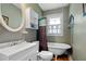 Updated bathroom with pedestal sink, clawfoot tub, and shower at 319 N Wales Dr, Lake Wales, FL 33853