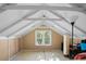 Unfinished attic room with dormer window at 319 N Wales Dr, Lake Wales, FL 33853