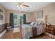 Spacious bedroom with a wooden bed frame and large windows at 319 N Wales Dr, Lake Wales, FL 33853