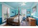 Bedroom with a four poster bed and teal walls at 319 N Wales Dr, Lake Wales, FL 33853