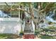 House exterior with stairs, landscaping, and white picket fence at 319 N Wales Dr, Lake Wales, FL 33853