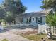 Gray house with white picket fence, and a spacious yard at 319 N Wales Dr, Lake Wales, FL 33853
