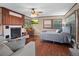 Cozy bedroom with wood floors, fireplace, and built-in shelving at 319 N Wales Dr, Lake Wales, FL 33853