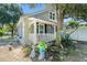 House exterior with porch, landscaping, and white picket fence at 319 N Wales Dr, Lake Wales, FL 33853