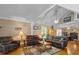 Open living room with high ceilings, hardwood floors and seating at 319 N Wales Dr, Lake Wales, FL 33853