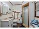 Clean bathroom with shower, sink, and storage at 319 N Wales Dr, Lake Wales, FL 33853