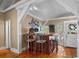 Rustic bar with wooden countertop and two stools at 319 N Wales Dr, Lake Wales, FL 33853