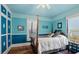 Bedroom with a four poster bed and teal walls at 319 N Wales Dr, Lake Wales, FL 33853