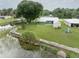 Aerial view of a waterfront home with a large backyard and boat dock at 3200 Citrus Ct, Lake Wales, FL 33898