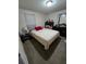 Cozy bedroom with double bed and window coverings at 2031 Poe St, Lakeland, FL 33801