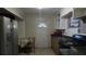 Kitchen with stove, refrigerator, and small table at 2031 Poe St, Lakeland, FL 33801