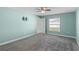 Bright bedroom featuring a window and ceiling fan at 625 Eisenhower St, Bartow, FL 33830