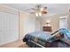 Bedroom with double bed, ceiling fan, and ample closet space at 2200 Starboard, Winter Haven, FL 33881