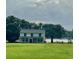 Two-story house on a lakefront property with green lawn at 915 C F Kinney Rd, Lake Wales, FL 33859