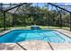 Inviting screened pool with a water feature, surrounded by lush landscaping at 1001 Tequesta Trl, Lake Wales, FL 33898