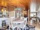 Open concept dining area with white table and chairs and kitchen views at 4 Casarena Ct, Winter Haven, FL 33881