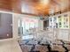 Bright dining room with white table and chairs, and a stained glass chandelier at 4 Casarena Ct, Winter Haven, FL 33881