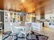 Modern kitchen with white cabinets, stainless steel appliances, and a breakfast bar at 4 Casarena Ct, Winter Haven, FL 33881