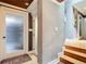 Elegant hallway with textured walls and wood stairs at 4 Casarena Ct, Winter Haven, FL 33881