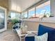 Bright and airy sunroom with ample seating and views of the outdoors at 4 Casarena Ct, Winter Haven, FL 33881