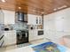 Modern kitchen with white cabinets, stainless steel appliances, and tile backsplash at 4 Casarena Ct, Winter Haven, FL 33881