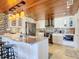 Modern kitchen with white cabinets, stainless steel appliances, and tile backsplash at 4 Casarena Ct, Winter Haven, FL 33881