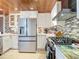 Modern kitchen with stainless steel appliances and tile backsplash at 4 Casarena Ct, Winter Haven, FL 33881