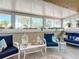 Relaxing sunroom with comfortable seating and plenty of natural light at 4 Casarena Ct, Winter Haven, FL 33881