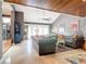 Spacious living room with gray sofas, wood-beamed ceiling, and access to the patio at 4 Casarena Ct, Winter Haven, FL 33881