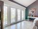 Bright entryway with stunning stained-glass doors and tile flooring at 4 Casarena Ct, Winter Haven, FL 33881