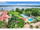 Aerial showcasing a community by the lake, with tennis courts and a pool at 4 Casarena Ct, Winter Haven, FL 33881