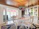 Bright dining room with white table and chairs, and a stained glass chandelier at 4 Casarena Ct, Winter Haven, FL 33881