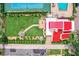 Aerial view showing home, pool, tennis court, and lush landscaping at 4 Casarena Ct, Winter Haven, FL 33881