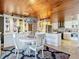 Modern kitchen with white cabinets, stainless steel appliances, and a breakfast bar at 4 Casarena Ct, Winter Haven, FL 33881