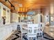 Open concept dining area with white table and chairs, adjacent to kitchen at 4 Casarena Ct, Winter Haven, FL 33881