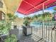 Spacious balcony with seating, potted plants, and pool view at 4 Casarena Ct, Winter Haven, FL 33881