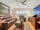 Relaxing living room featuring leather furniture and wood floors at 4 Casarena Ct, Winter Haven, FL 33881