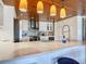 Modern kitchen with white cabinets and breakfast bar at 4 Casarena Ct, Winter Haven, FL 33881