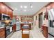 Updated kitchen with stainless steel appliances and ample counter space at 4496 Strathmore Dr, Lake Wales, FL 33859