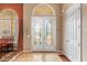 Elegant entryway with double glass doors and tile flooring at 4496 Strathmore Dr, Lake Wales, FL 33859