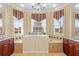 Large bathroom with walk-in tub, double vanity, and plenty of natural light at 4496 Strathmore Dr, Lake Wales, FL 33859