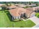 Aerial view of a charming house with well-maintained landscaping at 4496 Strathmore Dr, Lake Wales, FL 33859