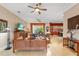 Spacious living room with wooden furniture and ceiling fan at 4496 Strathmore Dr, Lake Wales, FL 33859