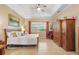 Spacious bedroom with king-size bed, ceiling fan, and large windows at 4496 Strathmore Dr, Lake Wales, FL 33859