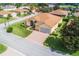 Aerial view showcasing a single-story house with a two-car garage at 4496 Strathmore Dr, Lake Wales, FL 33859