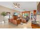 Spacious living room featuring hardwood floors, comfortable seating, and large windows at 4496 Strathmore Dr, Lake Wales, FL 33859
